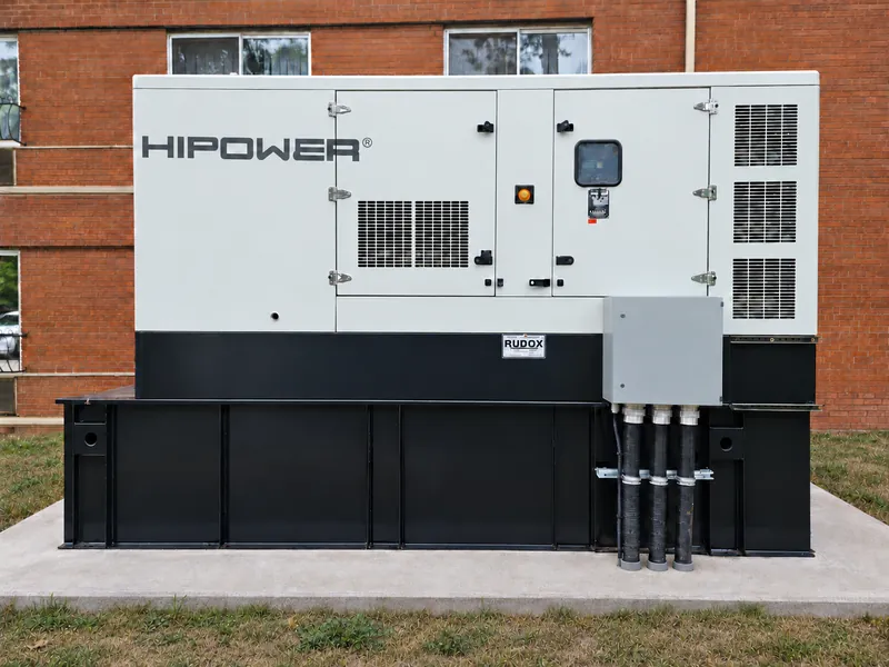 Standby generator installed on a concrete pad with conduit runs to the transfer equipment